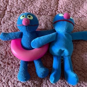 See if two stuffed Grover dolls